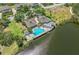 Aerial view of community clubhouse, pool, hot tub, and lake at 12 Tidy Island Blvd, Bradenton, FL 34210