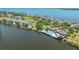 Aerial view of waterfront community with private pools, docks, and beautiful landscaping at 12 Tidy Island Blvd, Bradenton, FL 34210