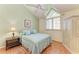 Bright bedroom featuring light-green walls and vaulted ceiling at 12 Tidy Island Blvd, Bradenton, FL 34210
