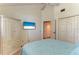 Bright bedroom featuring an entertainment center and closet at 12 Tidy Island Blvd, Bradenton, FL 34210