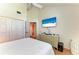 Bright bedroom features a TV, dresser, and closet, providing ample storage at 12 Tidy Island Blvd, Bradenton, FL 34210