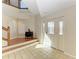 Bright foyer with tile flooring, wood stairs, and leaded glass front door at 12 Tidy Island Blvd, Bradenton, FL 34210