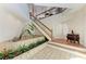 Grand foyer with tiled planter, hardwood stairs, and high ceilings at 12 Tidy Island Blvd, Bradenton, FL 34210