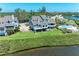 Inviting waterfront home with manicured lawn and spacious patio overlooking the water at 12 Tidy Island Blvd, Bradenton, FL 34210