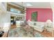 Sun-filled living room features vaulted ceilings with skylights and colorful walls at 12 Tidy Island Blvd, Bradenton, FL 34210