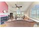 Bright living room with a fireplace, large windows, and water view at 12 Tidy Island Blvd, Bradenton, FL 34210