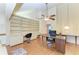 Spacious home office with built-in bookcases, desk, and chair at 12 Tidy Island Blvd, Bradenton, FL 34210