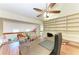 Bright and spacious home office with built-in shelving and a seating area at 12 Tidy Island Blvd, Bradenton, FL 34210