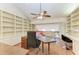 Home office with built-in bookcases and a comfortable seating area at 12 Tidy Island Blvd, Bradenton, FL 34210