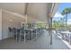Outdoor bar and grilling area with mounted TV and seating at 12 Tidy Island Blvd, Bradenton, FL 34210