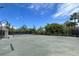 Community tennis court with mature trees surrounding the court at 12 Tidy Island Blvd, Bradenton, FL 34210