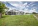 Spacious backyard with an enclosed lanai and pool area offers great outdoor recreational opportunities at 12026 Warwick Cir, Parrish, FL 34219