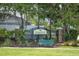 Kingsfield community entrance sign surrounded by mature landscaping and flowers creates a welcoming curb appeal at 12026 Warwick Cir, Parrish, FL 34219