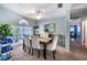 Bright dining room with a large window, a stylish dining table, and comfortable upholstered chairs at 12026 Warwick Cir, Parrish, FL 34219