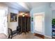 Inviting entryway featuring tile flooring, bench, and a decorative screen at 12026 Warwick Cir, Parrish, FL 34219