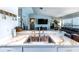 Bright and airy kitchen featuring marble countertops, white cabinetry, stainless steel appliances, and open layout at 12026 Warwick Cir, Parrish, FL 34219
