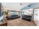 Bright living area offering carpet floors and views to the kitchen and outside at 12026 Warwick Cir, Parrish, FL 34219