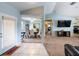 Open-concept living area showcasing neutral tones, tile, and carpet flooring at 12026 Warwick Cir, Parrish, FL 34219