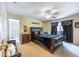Spacious main bedroom featuring a leather bed frame and ensuite bathroom access at 12026 Warwick Cir, Parrish, FL 34219