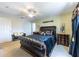 This spacious main bedroom offers a ceiling fan and luxury furniture at 12026 Warwick Cir, Parrish, FL 34219
