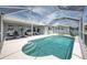 Backyard pool and lanai area has a seating area and backyard for relaxing and entertaining friends at 12026 Warwick Cir, Parrish, FL 34219