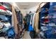 Organized walk-in closet with ample shelving and storage for clothing and accessories at 12026 Warwick Cir, Parrish, FL 34219