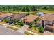 Scenic aerial view overlooking the properties with lush landscaping and a serene pond at 12315 Canavese Ln, Venice, FL 34293