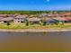 Backyard with homes overlooking a waterfront view at 12315 Canavese Ln, Venice, FL 34293