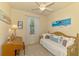 Bright bedroom with twin bed, ceiling fan, and window allowing natural light at 12315 Canavese Ln, Venice, FL 34293