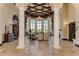 Spacious clubhouse lobby boasts tall ceilings, columns, and decorative chandeliers at 12315 Canavese Ln, Venice, FL 34293
