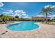 Large community pool with ample room for sunbathing and views of the clubhouse at 12315 Canavese Ln, Venice, FL 34293