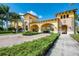 Stately community entrance features decorative architecture, manicured landscaping, and inviting access for residents at 12315 Canavese Ln, Venice, FL 34293