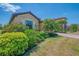 Beautiful single-Gathering home with a well-maintained lawn, lush bushes and attractive landscaping at 12315 Canavese Ln, Venice, FL 34293