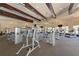 Well-equipped gym featuring modern machines, ceiling fans, and ample natural light for a healthy workout experience at 12315 Canavese Ln, Venice, FL 34293