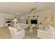 Bright living room has neutral colors, ceiling fan, media center, and an open floor plan at 12315 Canavese Ln, Venice, FL 34293