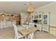 Living area includes a dining table and a built-in hutch for storage at 12315 Canavese Ln, Venice, FL 34293