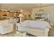 Bright living room opens to the kitchen and features neutral colors and an open floor plan at 12315 Canavese Ln, Venice, FL 34293