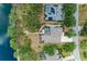 Overhead aerial view of the home highlighting a serene pool, lush landscaping, and proximity to the lake at 127 Mill E Run, Bradenton, FL 34212