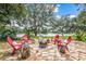 Outdoor area with stone patio, fire pit, and scenic lake views, relaxing place to unwind at 127 Mill E Run, Bradenton, FL 34212