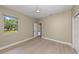 Bedroom with light wood floors, a ceiling fan, and a window overlooking the outside greenery at 127 Mill E Run, Bradenton, FL 34212