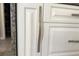 Cabinet detail showcasing white cabinets with elegant hardware, adding sophistication to the space at 127 Mill E Run, Bradenton, FL 34212