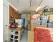 Organized garage with workbench, tool storage, and storage bins, maximizing space and functionality at 127 Mill E Run, Bradenton, FL 34212