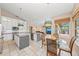 Eat-in kitchen featuring granite countertops, stainless steel appliances, and a view of the outdoor patio at 127 Mill E Run, Bradenton, FL 34212