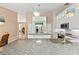 Bright kitchen featuring granite countertops, a central island, ample cabinet space, and modern stainless steel appliances at 127 Mill E Run, Bradenton, FL 34212