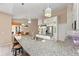 Well-appointed kitchen with granite counters, stainless steel appliances, an island, and an open design into the breakfast nook at 127 Mill E Run, Bradenton, FL 34212