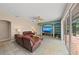 Spacious living room with sliding glass doors and seamless connection to the outdoor patio at 127 Mill E Run, Bradenton, FL 34212