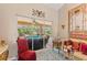 Comfortable living room with large sliding glass doors offering a view of the outdoor patio and screened-in pool at 127 Mill E Run, Bradenton, FL 34212