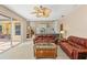 Spacious living room connecting to a modern kitchen and breakfast nook, creating a seamless flow for entertaining and dining at 127 Mill E Run, Bradenton, FL 34212