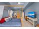 Comfortable bedroom with a canopy bed, a fan, and a wall-mounted television at 127 Mill E Run, Bradenton, FL 34212