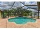 Screened in pool area featuring a spa and a brick patio for outdoor relaxation at 127 Mill E Run, Bradenton, FL 34212